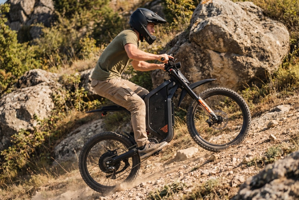 A rider tackling a steep hill climb on the EKX X21 Max electric dirt bike, demonstrating the 180 Nm of torque and 6000W peak brushless motor on a rugged off-road trail.